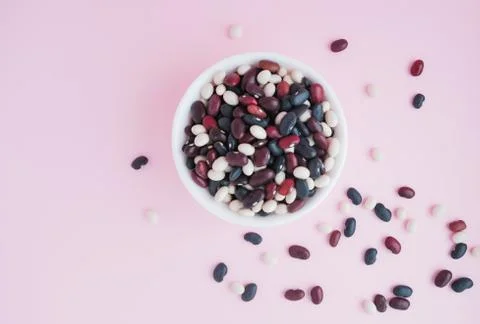 Raw beans in a cup on the background Stock Photos