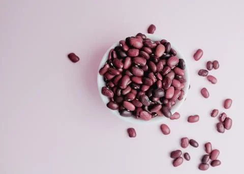 Raw beans in a cup on the background Stock Photos