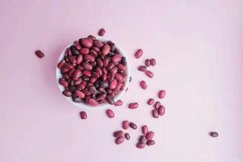 Raw beans in a cup on the background Stock Photos