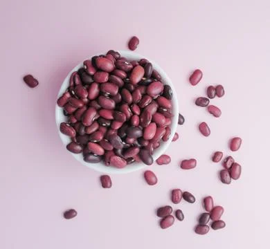 Raw beans in a cup on the background Stock Photos