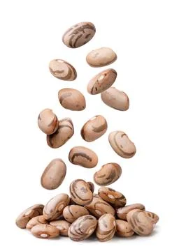 Raw beans falling on a pile close-up on a white. Isolated Stock Photos