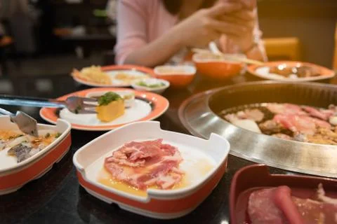 Raw beef and pork slice on grille for barbecue or Japanese style yakiniku Stock Photos