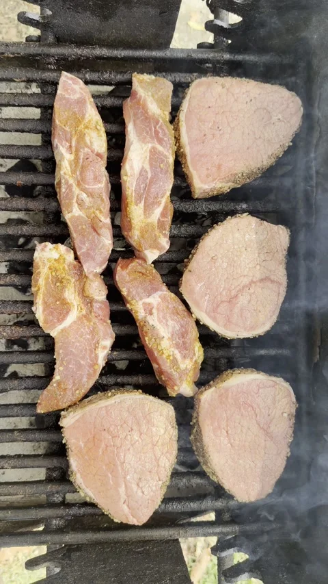 Raw Beef on Barbecue Grill, Top View, Vertical 4K Stock Footage 340176002