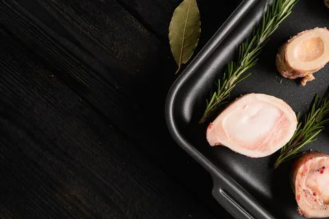 Raw Beef Bones for Making Broth at Home, on black wooden table background, to Stock Photos