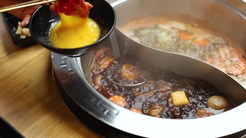 Raw Beef Dipped in Egg for Japanese Hot Pot Cooking Stock Footage 321664028