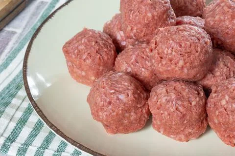 Raw beef dumplings on a plate Stock Photos