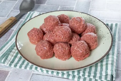 Raw beef dumplings on a plate Stock Photos