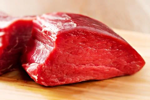 Raw beef filet Mignon steak on a wooden Board. Stock Photos