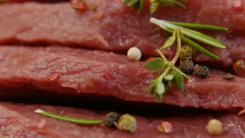 Raw beef fillet with pepper and thyme, ready to grill. Stock Footage 90495400