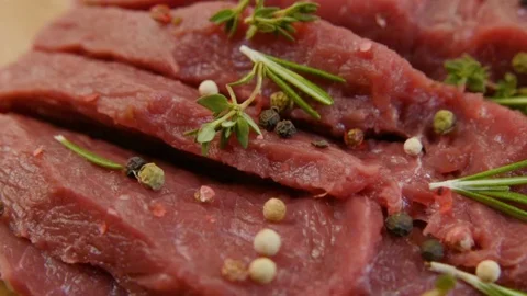 Raw beef fillet with pepper and thyme, ready to grill. Stock Footage 90495422
