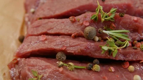 Raw beef fillet with pepper and thyme, ready to grill. Stock-Footage 90495432