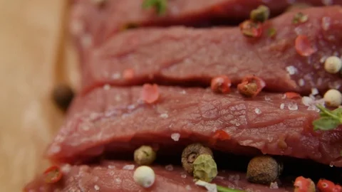 Raw beef fillet with pepper and thyme, ready to grill. Stock Footage 90495454