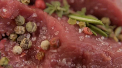 Raw beef fillet with pepper and thyme, ready to grill. Stock Footage 90495502