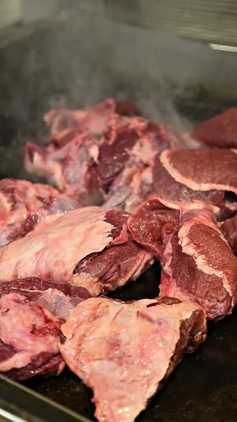 Raw beef grilled in a hot pan, perfect for food videos Stock Footage 310576608