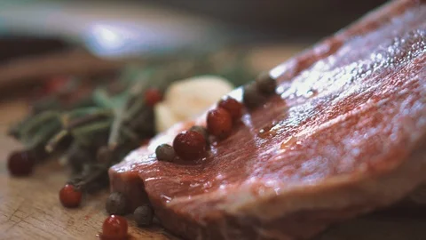 Raw beef before grilling rosemary and garlic Video stock 105319849