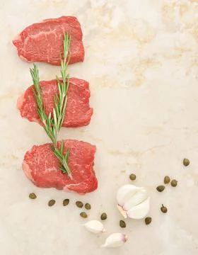 Raw beef on marble background Stock Photos