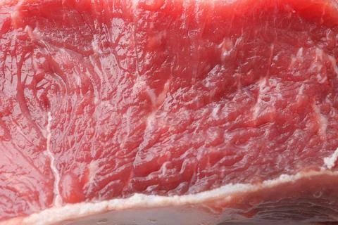 Raw beef meat as background, closeup view Stock Photos