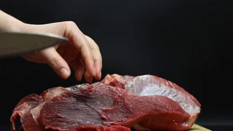 Raw beef meat on a black background Stock Footage 126573437