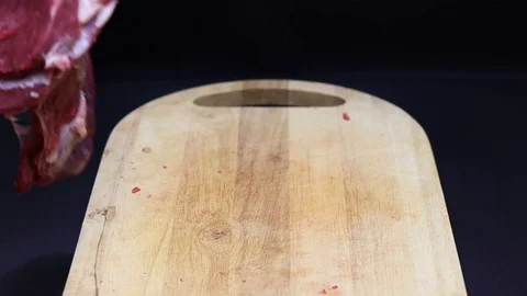 Raw beef meat on a black background Stock Footage 126573475