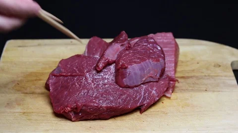 Raw beef meat on a black background Stock Footage 128283790