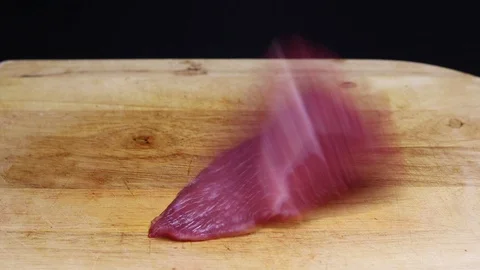 Raw beef meat on a black background Stock Footage 128284695