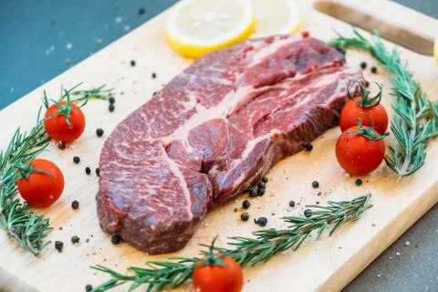 Raw beef meat on cutting board Stock Photos