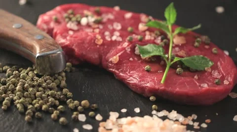 Raw beef meat fillet with peppercorn and thyme and differnt spices in glass 動画素材 66443178
