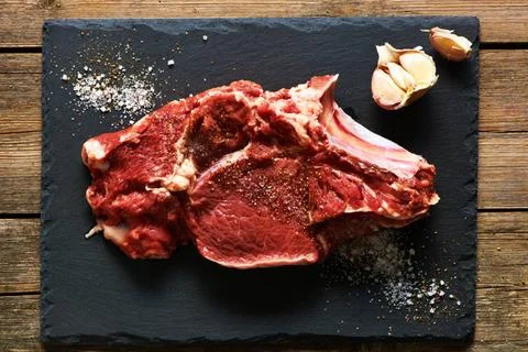 Raw beef meat Raw beef meat over slate Copyright: xZoonar.com/NikolaixOkhi... Stock Photos