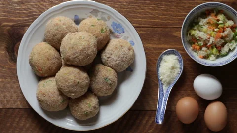 Raw beef meatballs ready to be cooked Stock Footage 152878787