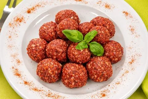 Raw beef meatballs with tomato Stock-Fotos