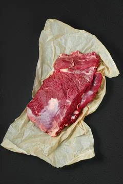 Raw beef neck on wrapping paper Stock-Fotos