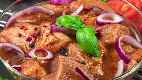 Raw beef or pork meat marinated. Raw kebab or shashlik in spices on black Stock Footage 239975267