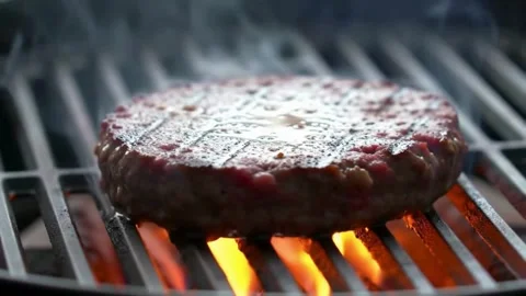 Raw Beef Patty Being Cooked to Perfection on Grill – Juicy Texture, High Heat Co Stock Footage 326355382