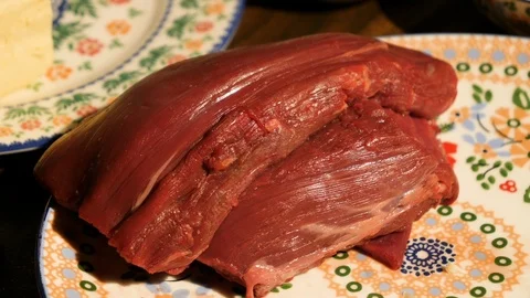 Raw beef in a plate on the table Stock Footage 121494758