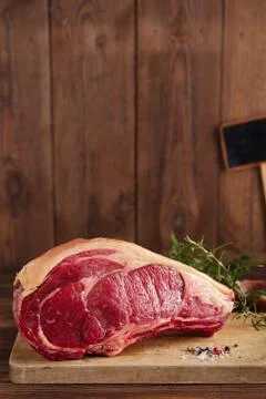Raw beef Rib bone  steak   on wooden board and table Stock Photos