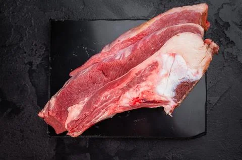 Raw beef rib cut with bone, marrow and connective tissue, perfect for simme.. Stock Photos