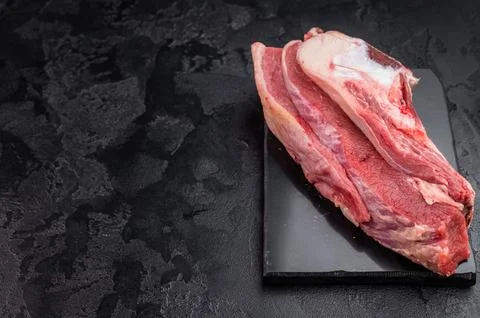 Raw beef rib cut with bone, marrow and connective tissue, perfect for simme.. Stock Photos