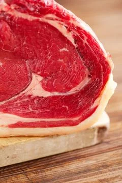 Raw beef Rib steak with bone on wooden board and table Stock Photos