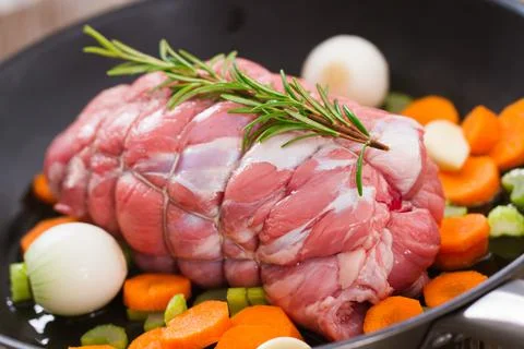 Raw Beef Roast in a Pan . High quality photo. Stock Photos