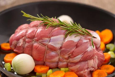 Raw Beef Roast in a Pan . High quality photo. Stock Photos