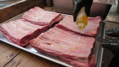 Raw Beef Short Ribs Preparation for Barbecue on Metal Tray Stock Footage 338212355