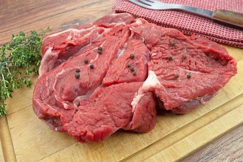 Raw beef side on a cutting board Stock Photos