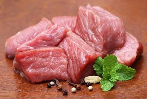 Raw beef with spices Stock Photos