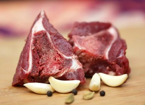 Raw beef with spices Stock Photos