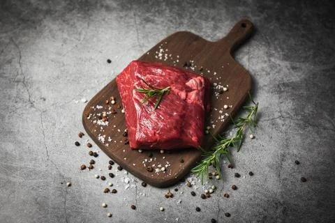 Raw beef steak with herb and spices - Fresh meat beef sliced on wooden cutt.. Stock Photos