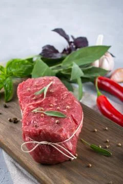 Raw beef steak with ingredients for cooking on cutting board . Stock Photos