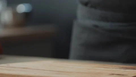 Raw Beef Steak Placed on a Wooden Cutting Board in a Professional Kitchen Vidéo 331100883