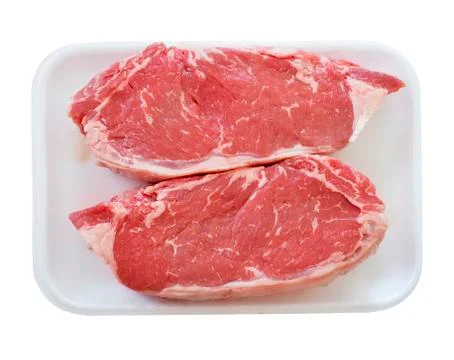 Raw beef steak in a plastic or foam  tray Stock Photos