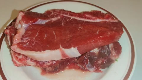 A raw beef steak on the  plate 動画素材 241691770