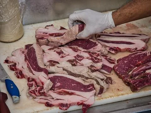 Raw beef steak served in a restaurant. Stock Photos